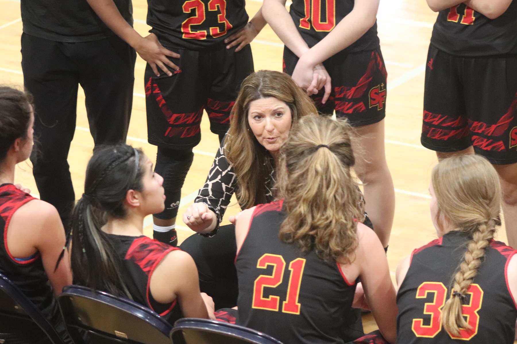 Coach Heather Instructs the Troubies during a time out.