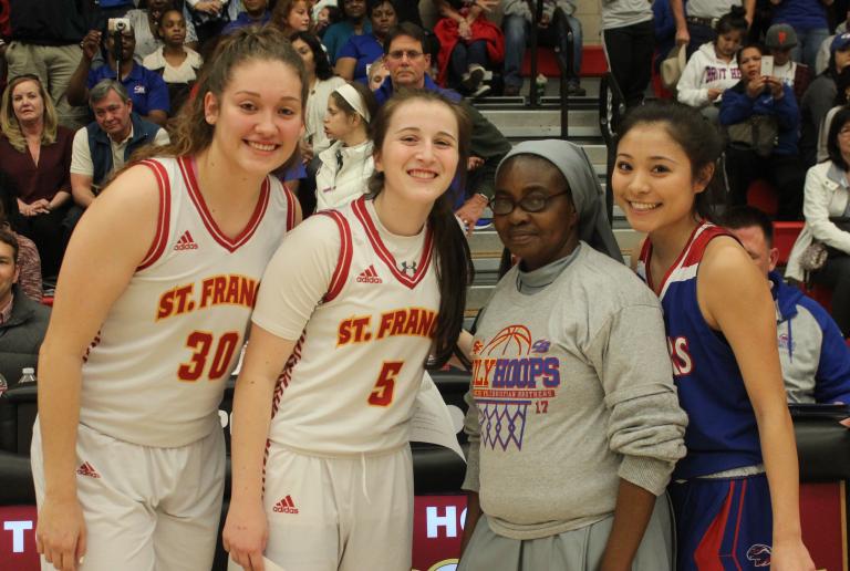Senior Razo Leads Basketball to Holy Hoops Win