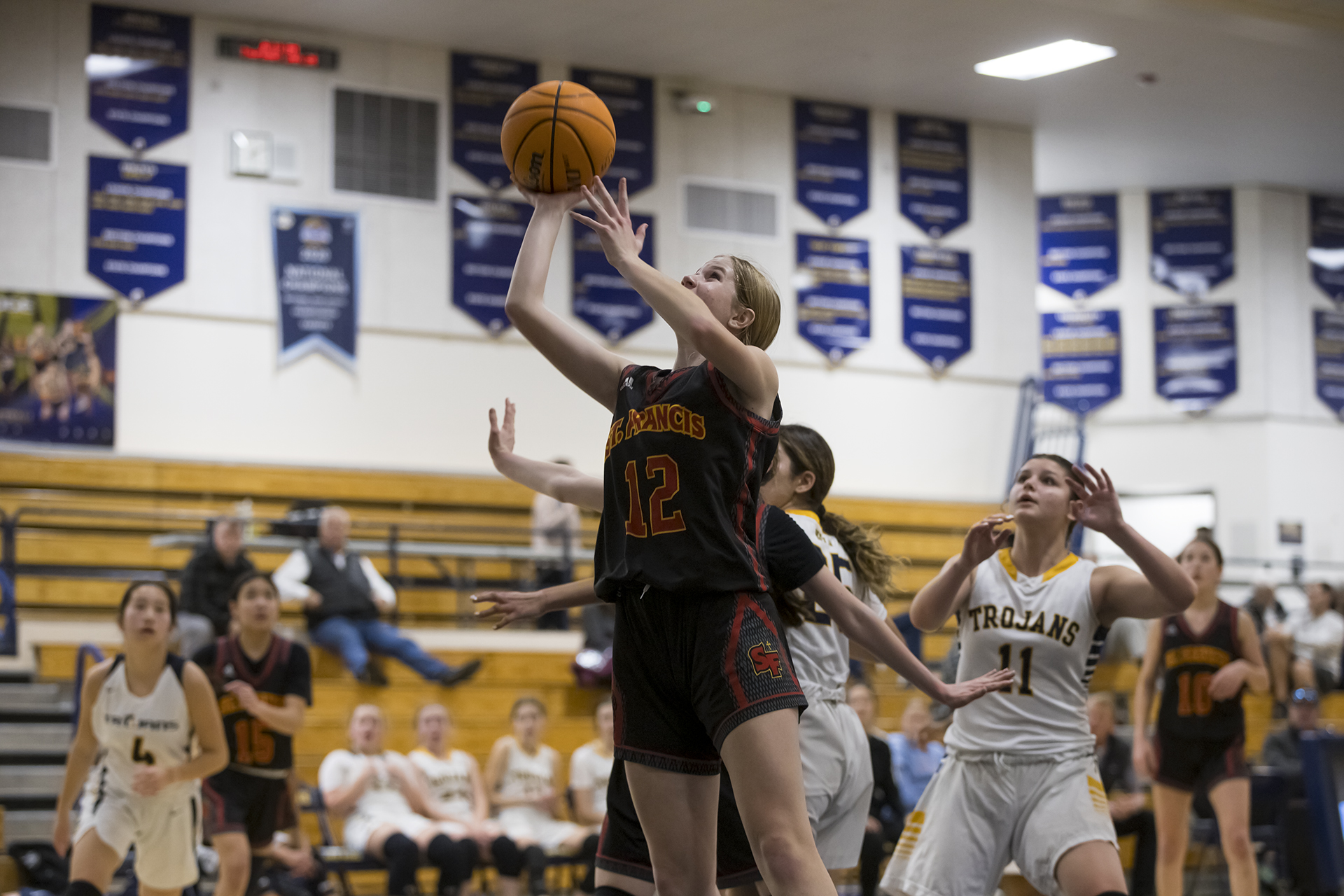 JV Red battles tough Trojans for third time in 2022-23